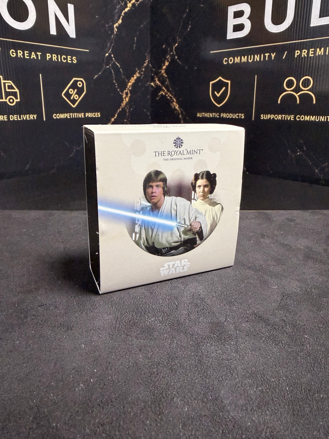 Original Royal Mint Luke Skywalker and Princess Leia presentation box showing handling wear