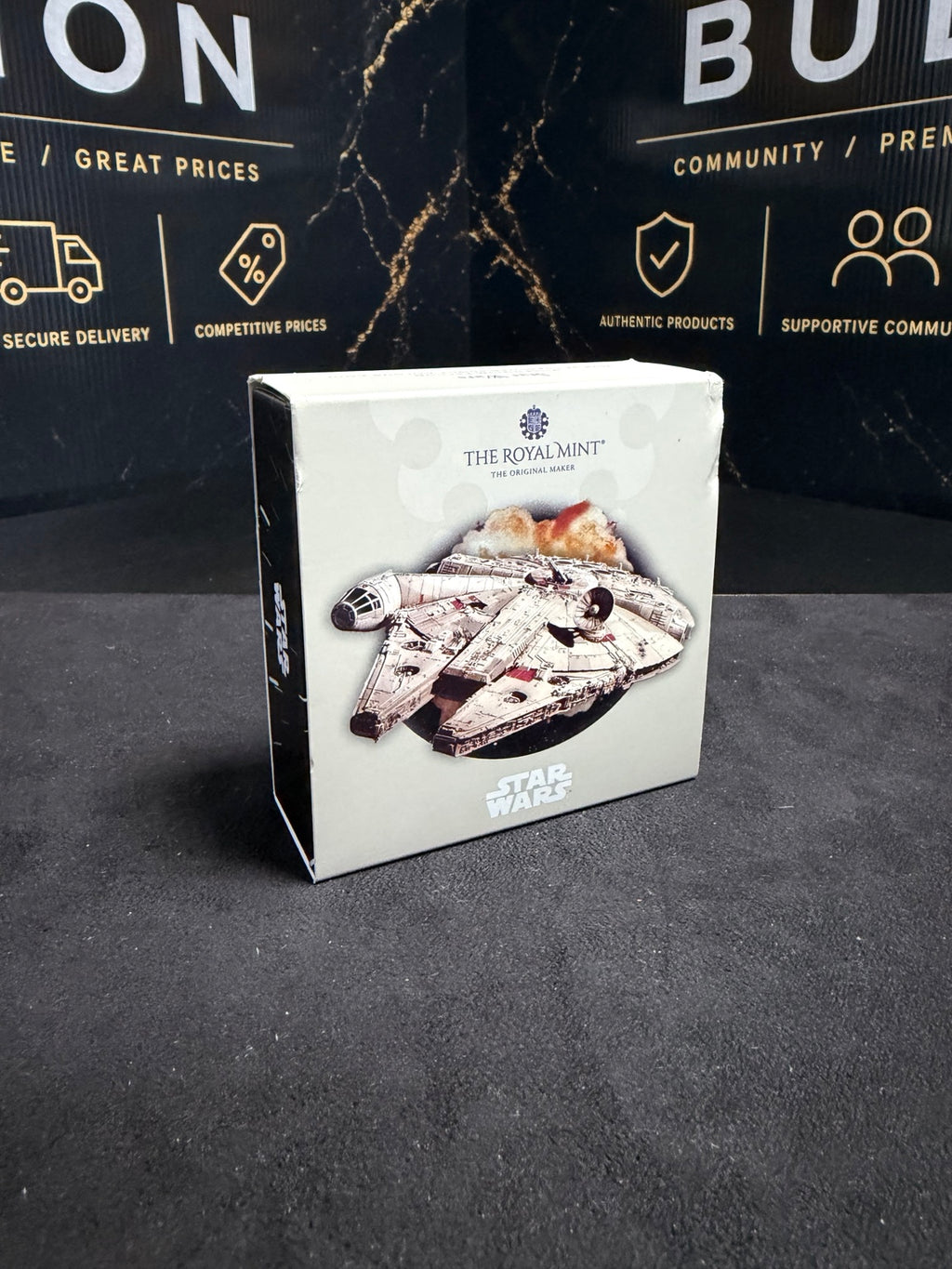 Front of original Royal Mint 2024 Millennium Falcon box, with visible cosmetic corner and edge wear