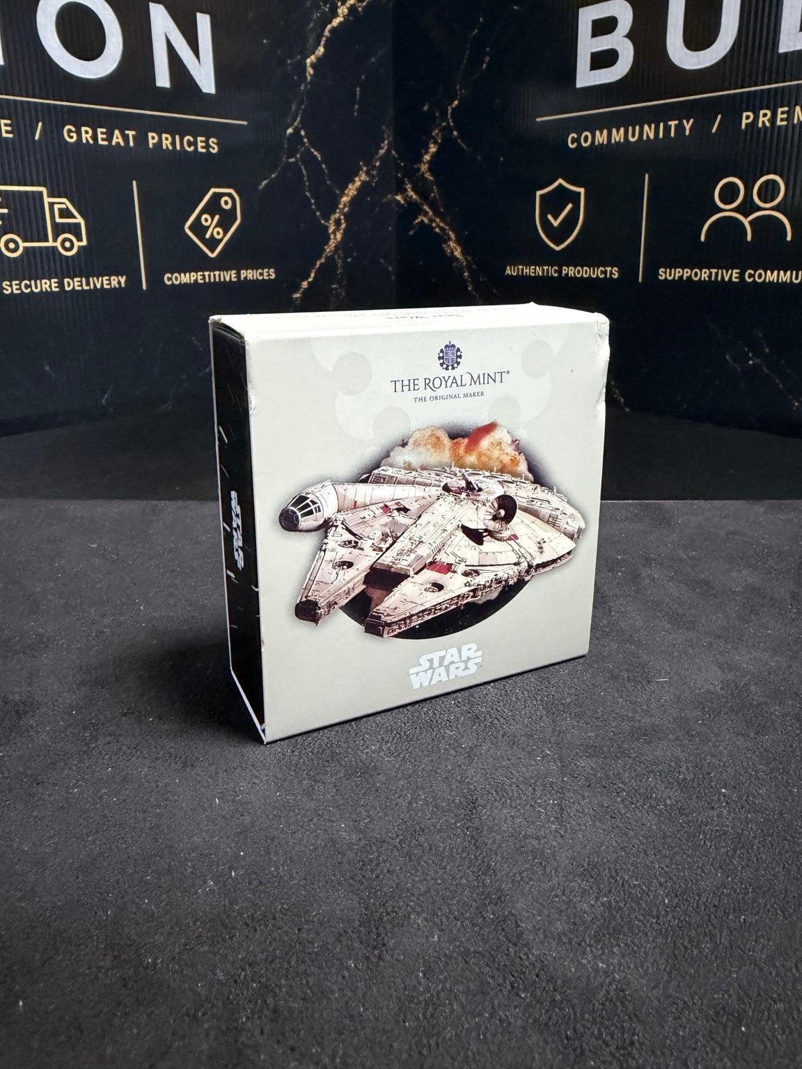 Front of original Royal Mint 2024 Millennium Falcon box, with visible cosmetic corner and edge wear