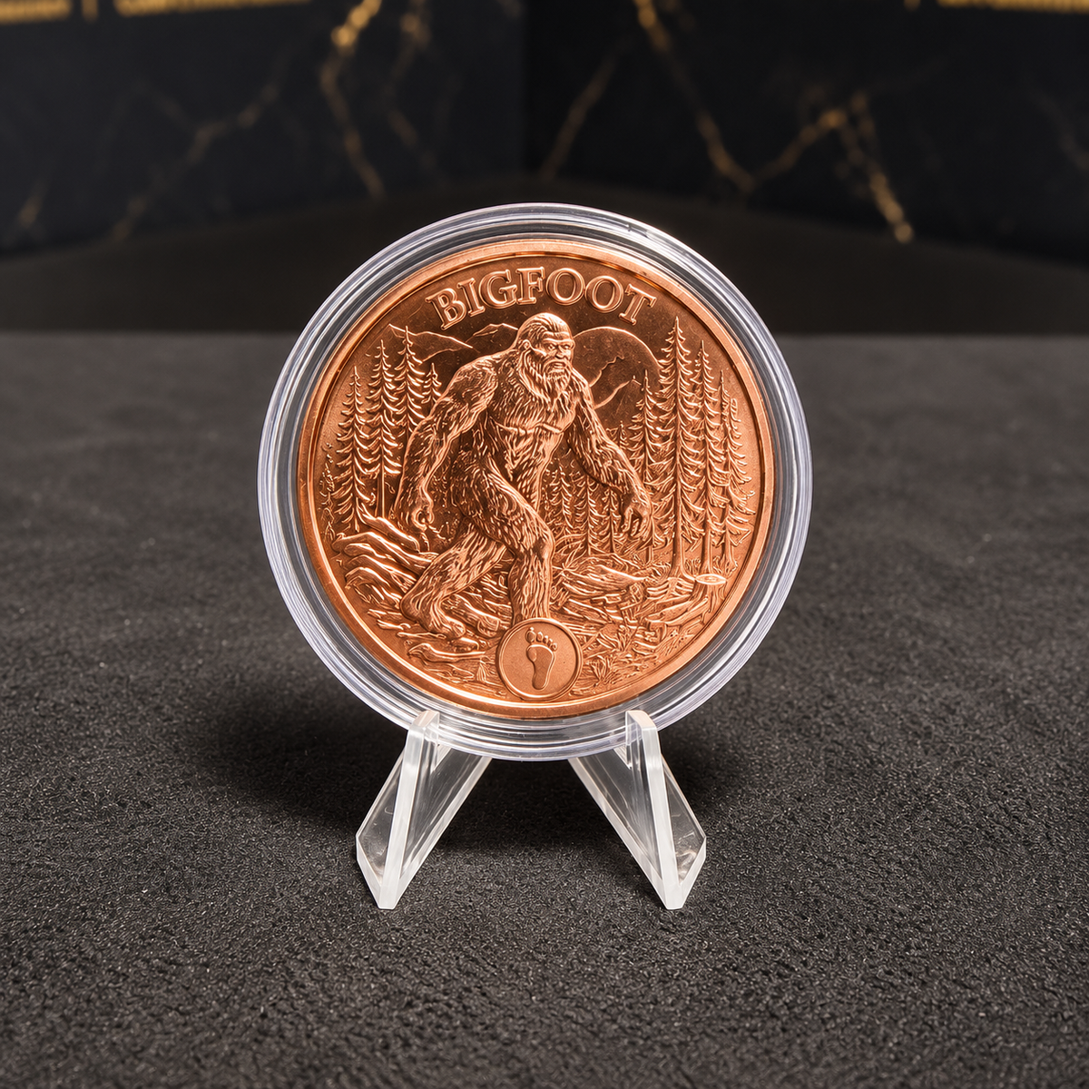 Bigfoot Tales of Old copper round 1 AVDP ounce 28.35g .999 copper, Sasquatch in forest with footprint emblem, clear capsule; photograph enhanced