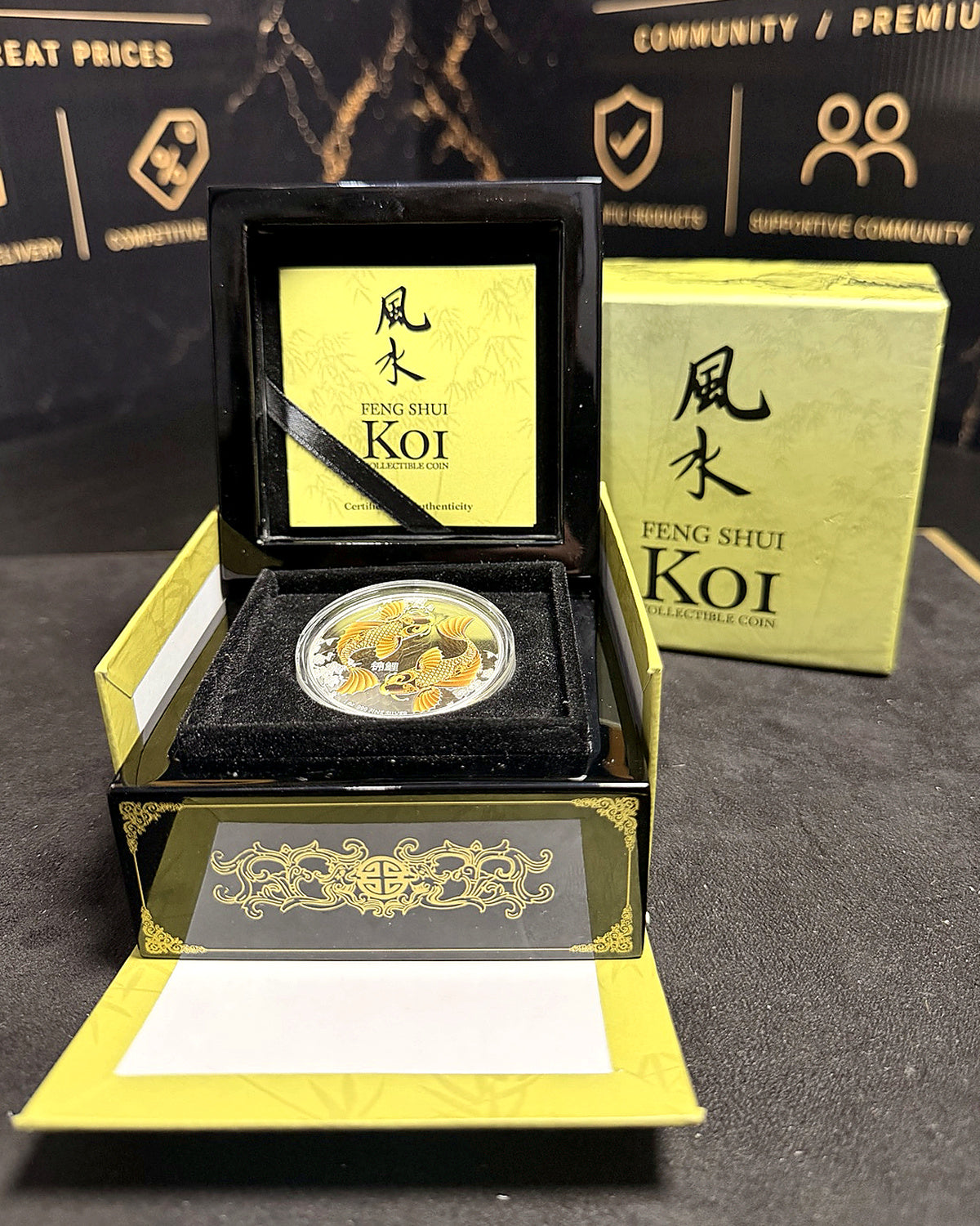 Feng Shui Koi silver proof presented inside the open lacquered case with original outer box