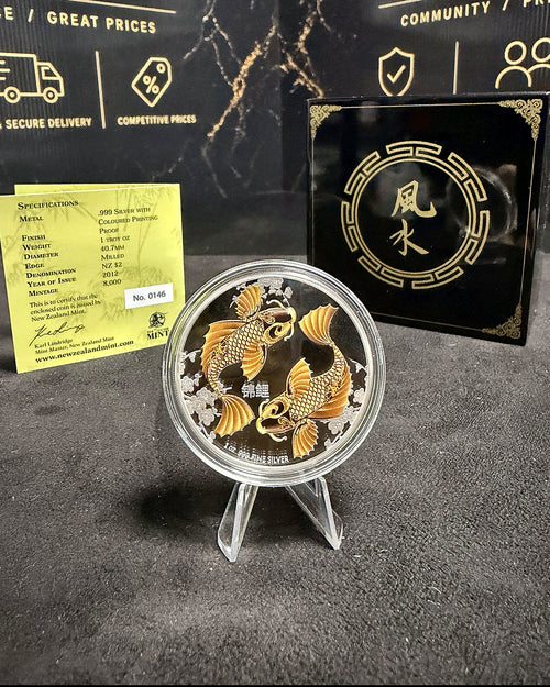 Close-up of golden coloured twin Koi 2012 one ounce silver proof with certificate 0146