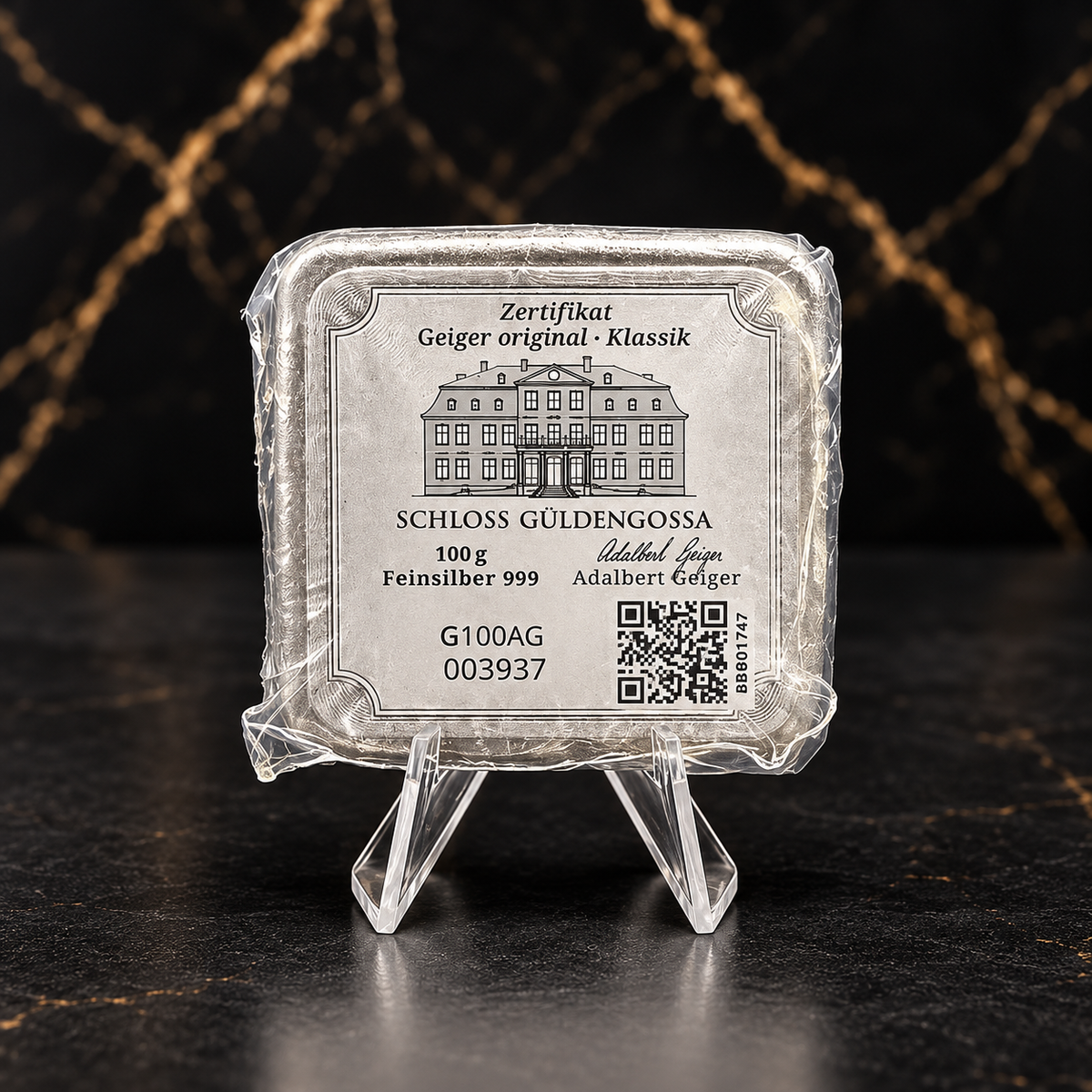 Reverse of Geiger Original Klassik 100g silver bar showing original certificate and serial G100AG 003937